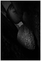 Talus cave with boulders at night. Pinnacles National Park, California, USA. (black and white)