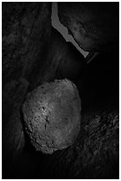 Boulder in Balconies talus cave at night. Pinnacles National Park, California, USA. (black and white)