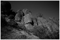 Looking up rock towers and starry night sky. Pinnacles National Park ( black and white)