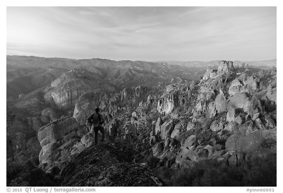 Visitor looking, Balconies and Square Block at dusk. Pinnacles National Park (black and white)