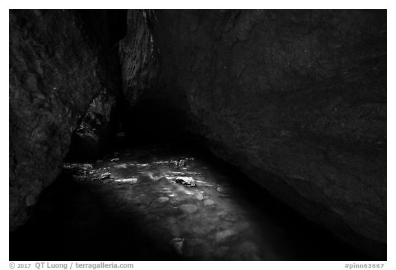 Light on stream in dark cave. Pinnacles National Park (black and white)