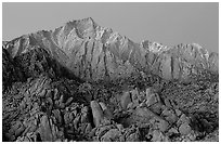 Volcanic boulders in Alabama hills and Lone Pine Peak, dawn. Sequoia National Park, California, USA. (black and white)