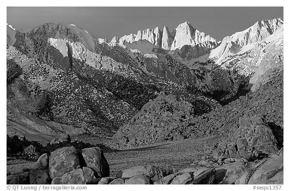 Volcanic boulders in Alabama hills and Mt Whitney, sunrise. Sequoia National Park (black and white)