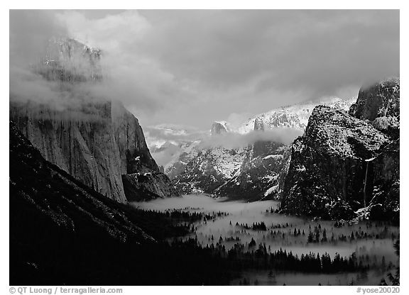 View with fog in valley and peaks lighted by sunset, winter. Yosemite National Park (black and white)