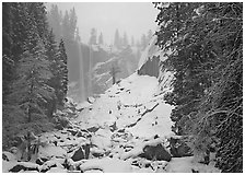 Thin flow of Vernal Fall in winter. Yosemite National Park ( black and white)