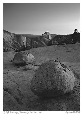 Glacial erratic boulders and Half Dome, Olmsted Point, dusk. Yosemite National Park (black and white)