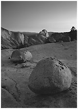Glacial erratic boulders and Half Dome, Olmsted Point, dusk. Yosemite National Park ( black and white)