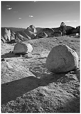 Glacial erratic boulders and Half Dome, Olmsted Point, afternoon. Yosemite National Park, California, USA. (black and white)