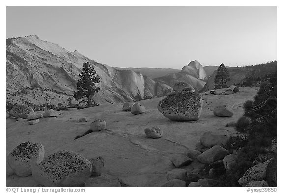 Glacial erratic boulders, Clouds Rest, and Half-Dome from Olmstedt Point, dusk. Yosemite National Park, California, USA.