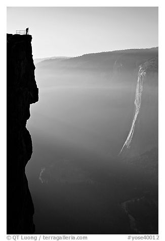 Hiker surveying Yosemite Valley from Profile Cliff overlook. Yosemite National Park (black and white)