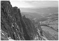 Cliffs on  North Face of Mount Hoffman with hiker standing on top. Yosemite National Park, California, USA. (black and white)