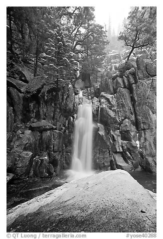 Snow-covered boulder and base of Chilnualna Falls. Yosemite National Park (black and white)