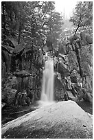Snow-covered boulder and base of Chilnualna Falls. Yosemite National Park ( black and white)