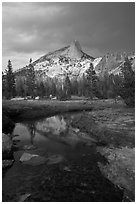 Cathedral Peak reflected in stream under stormy skies. Yosemite National Park ( black and white)