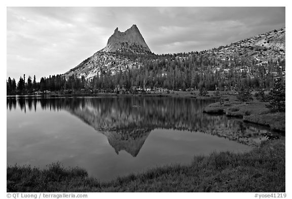 Cathedral Peak reflected in upper Cathedral Lake, late afternoon. Yosemite National Park, California, USA.