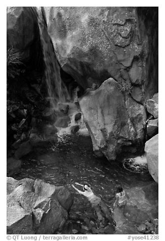 Swimmers in a pool at the base of Wapama falls, Hetch Hetchy. Yosemite National Park (black and white)