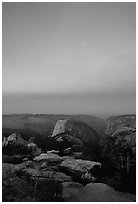 Half-Dome and Yosemite Valley under  pink hues of dawn sky. Yosemite National Park ( black and white)