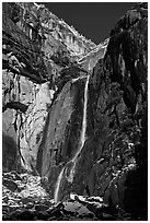 Lower Yosemite Falls and rock wall with snowy trees on rim. Yosemite National Park ( black and white)