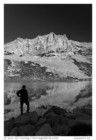 Hiker standing  on Roosevelt lakeshore. Yosemite National Park, California, USA.