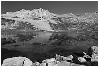 Rugged mountain reflected in Sierra Lake. Yosemite National Park ( black and white)