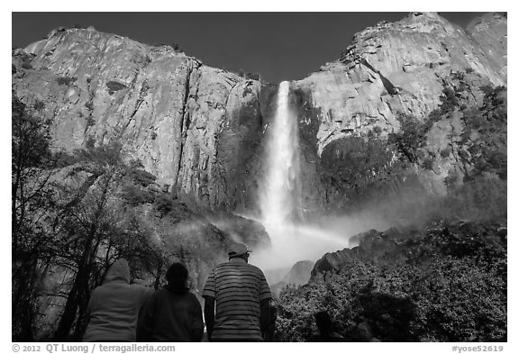 Tourists looking at Bridalvail Fall rainbow. Yosemite National Park (black and white)