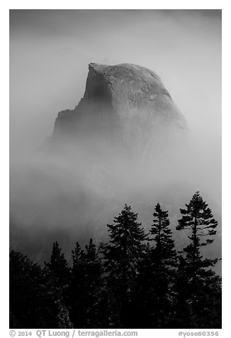 Half-Dome emerging from smoke at night. Yosemite National Park (black and white)