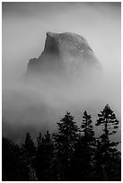 Half-Dome emerging from smoke at night. Yosemite National Park ( black and white)