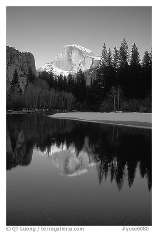 Half-Dome reflected in Merced River, winter sunset. Yosemite National Park (black and white)