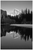 Half-Dome reflected in Merced River, winter sunset. Yosemite National Park ( black and white)