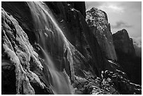 Seasonal waterfall and Cathedral Rocks in winter. Yosemite National Park ( black and white)