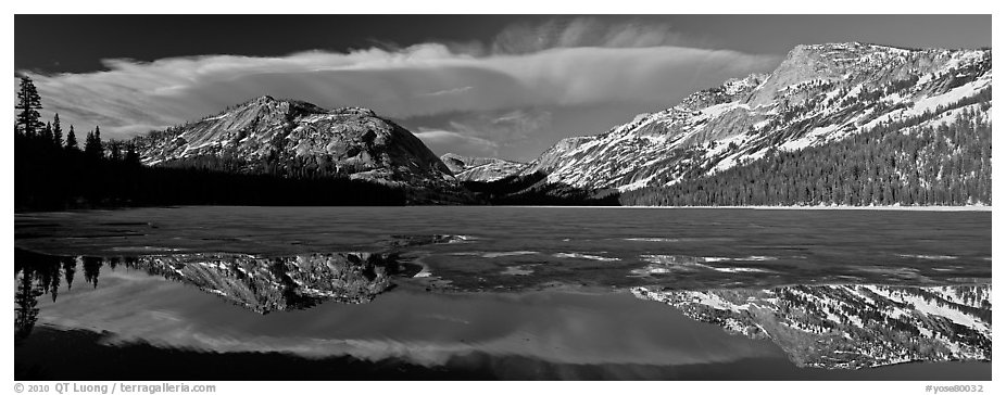 Mountains reflected in partly iced Tenaya Lake. Yosemite National Park (black and white)