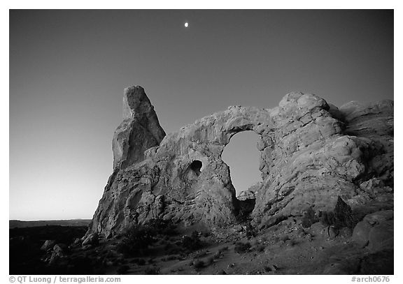Turret Arch and moon, dawn. Arches National Park (black and white)