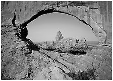 Turret Arch seen from rock opening. Arches National Park, Utah, USA. (black and white)