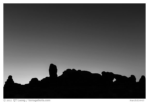 Windows Group silhouette at dawn. Arches National Park, Utah, USA.