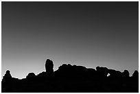 Windows Group silhouette at dawn. Arches National Park, Utah, USA. (black and white)