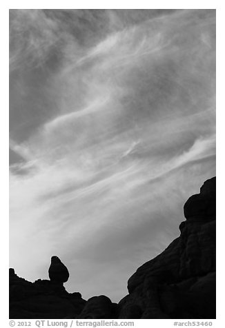 Sunset clouds and small balanced rock. Arches National Park (black and white)