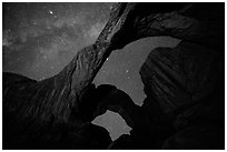 Double Arch at night with Milky Way. Arches National Park, Utah, USA. (black and white)