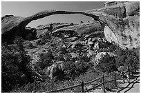 Visitor looking, Landscape Arch. Arches National Park, Utah, USA. (black and white)