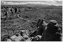 Scenic road seen from top of fin. Arches National Park, Utah, USA. (black and white)