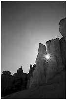 Sun star between hoodoos. Bryce Canyon National Park ( black and white)