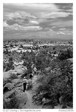 Hikers on the Chesler Park trail, the Needles. Canyonlands National Park (black and white)