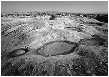 Empty pot holes on sandstone, Needles District. Canyonlands National Park ( black and white)