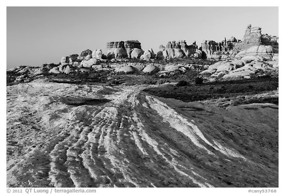 Sandstone swirls and Doll House spires, early morning. Canyonlands National Park, Utah, USA.