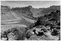 Hikers on steep trail to Dollhouse from Spanish Bottom. Canyonlands National Park ( black and white)