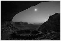 False Kiva and moon at night. Canyonlands National Park, Utah, USA. (black and white)