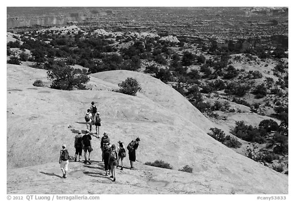 Hikers on Whale Rock. Canyonlands National Park (black and white)