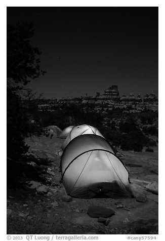 Lit tents at night in the Dollhouse. Canyonlands National Park (black and white)