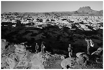 Hikers on Petes Mesa ridge above the Maze. Canyonlands National Park ( black and white)