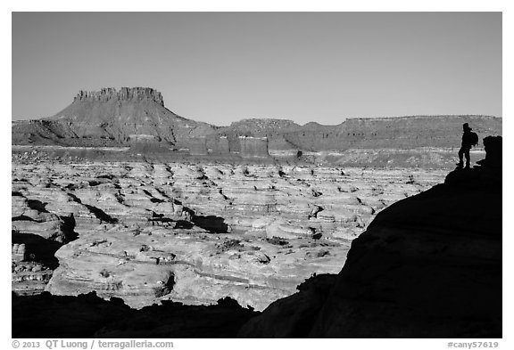 Hiker silhouette above the Maze and Chocolate drops. Canyonlands National Park (black and white)
