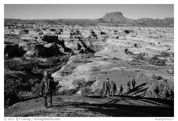 Group hiking down into the Maze. Canyonlands National Park (black and white)